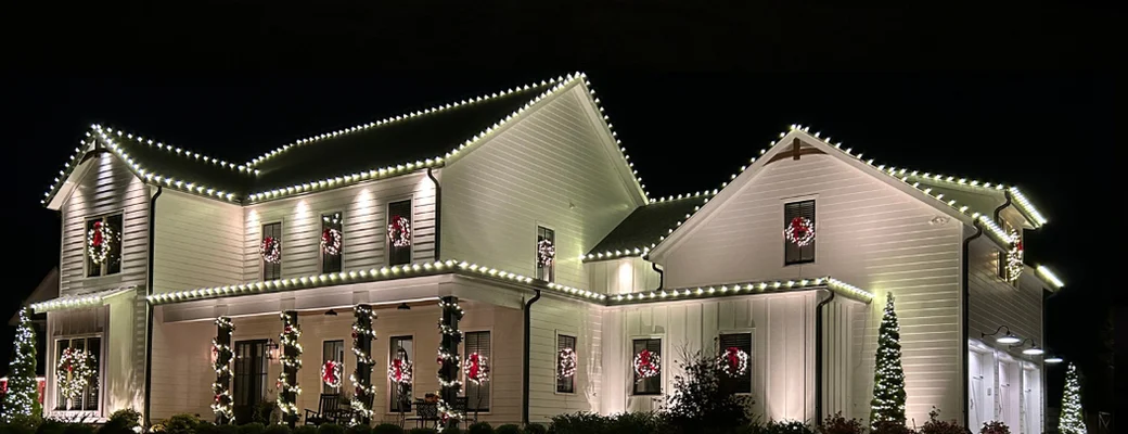 Holiday lights along the roofline of a Jolly Lights project home